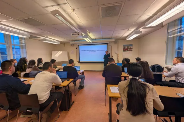 People sitting in the room and listening to the presentations. Photo.