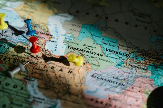 Map of Central Asia with colored push pins. Photo.